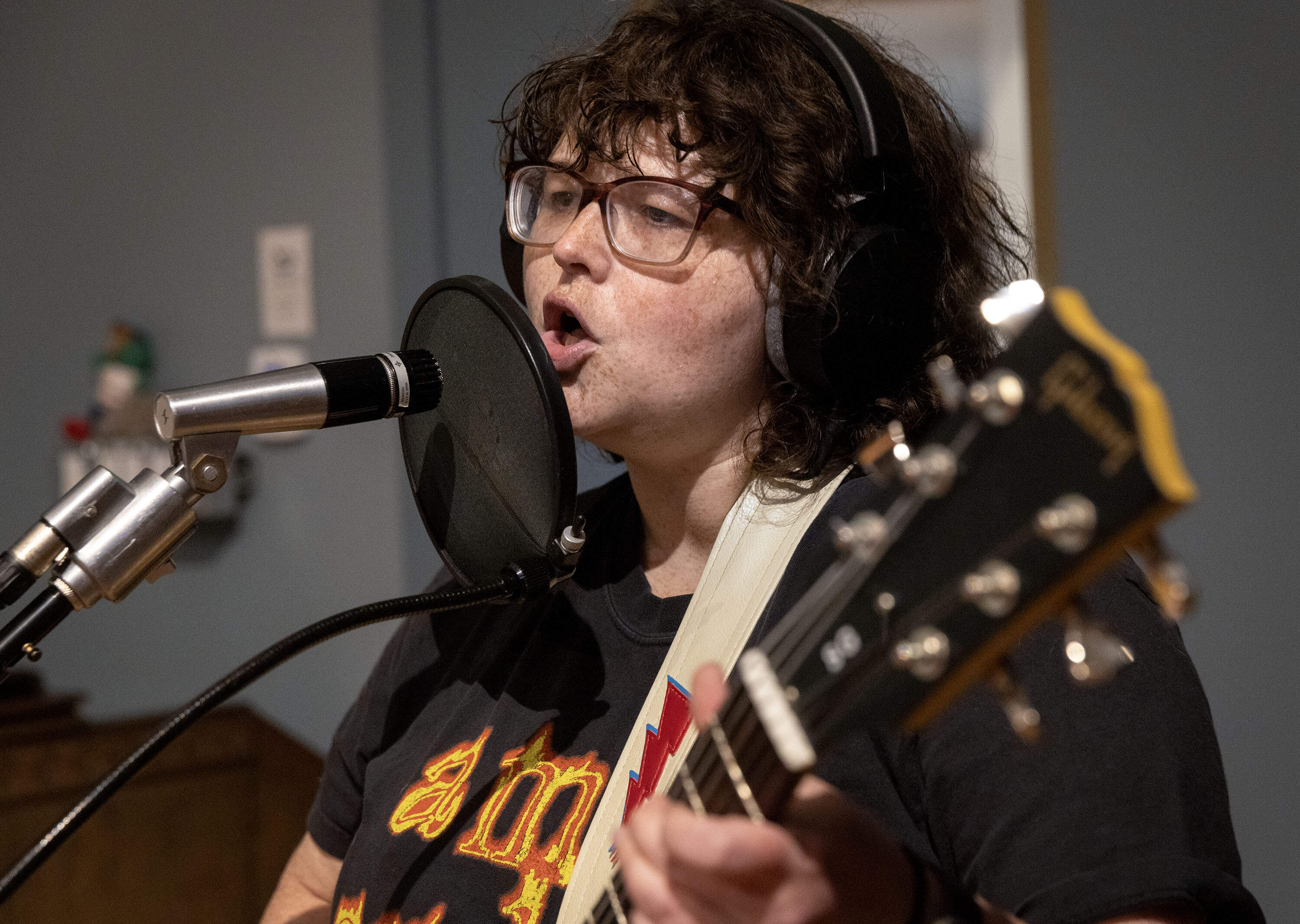 Musician Sam Coren sings at a 24 track tape recording of the band Astral Bitch in the Q Division studios in Cambridge, Mass. (Robin Lubbock/WBUR)