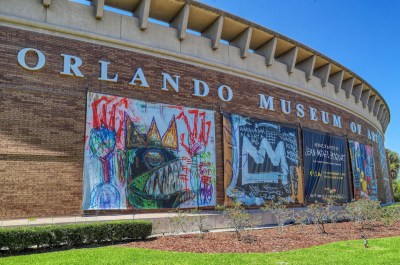 Signs for the Jean-Michel Basquiat exhibit outside the Orlando Museum of Art, on Friday, March 25, 2022