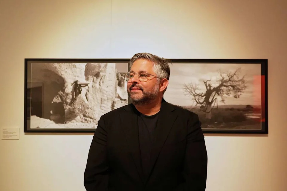 Matthew Goudeau, San Francisco's executive director of arts and culture, stands in front of Kelly Finley's artwork at the Veterans Building on July 15. He apologized to the arts grantees who have not been paid yet by the San Francisco Arts Commission in a statement. (Giselle Garza Lerma/For the S.F. Chronicle)