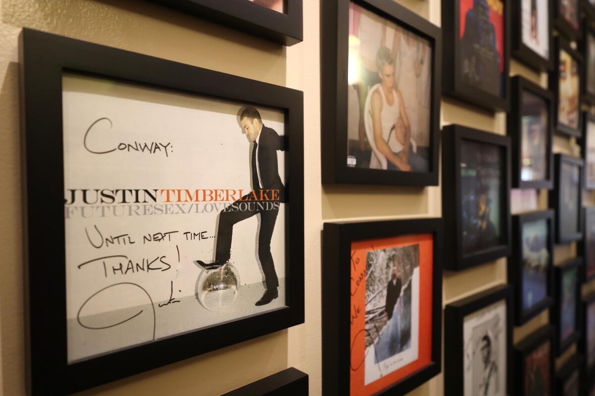 Framed album covers, featuring some of the artists who recorded at Conway Recordding Studios.