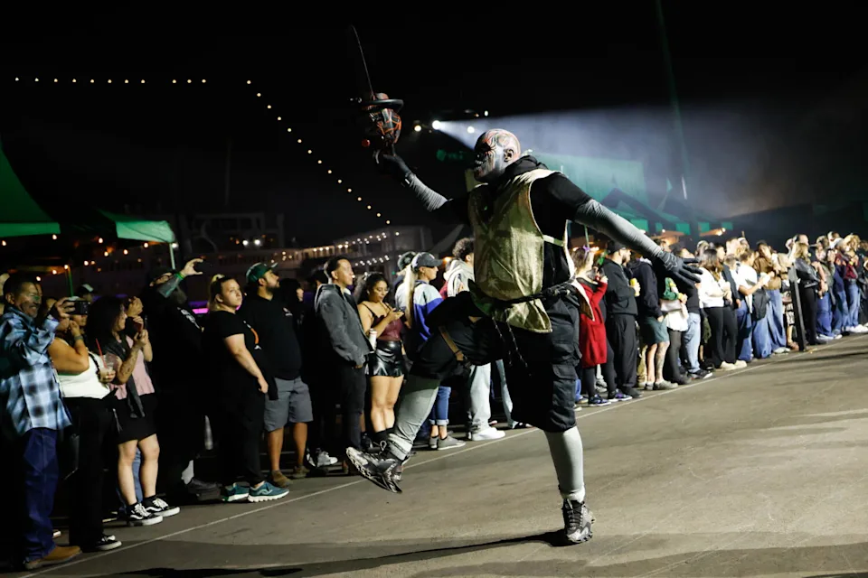 A scare actor performs at the Queen Mary's Dark Harbor.